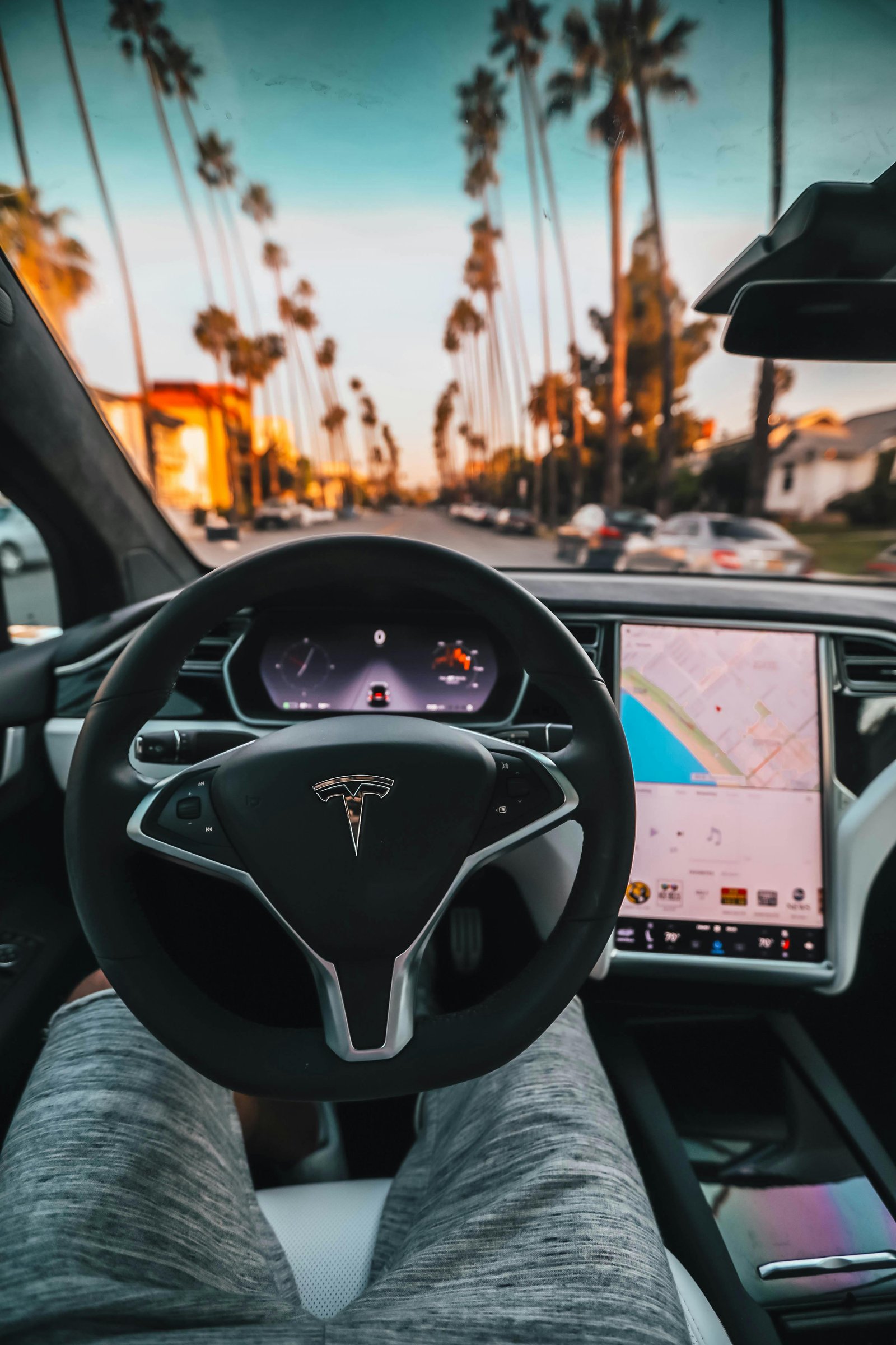 View from a car following a Tesla Model 3 on the highway, illustrating the risk of sudden braking.